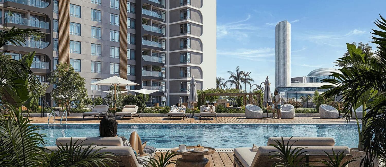 Resort-style poolside lounge with skyline views at Reportage Towers